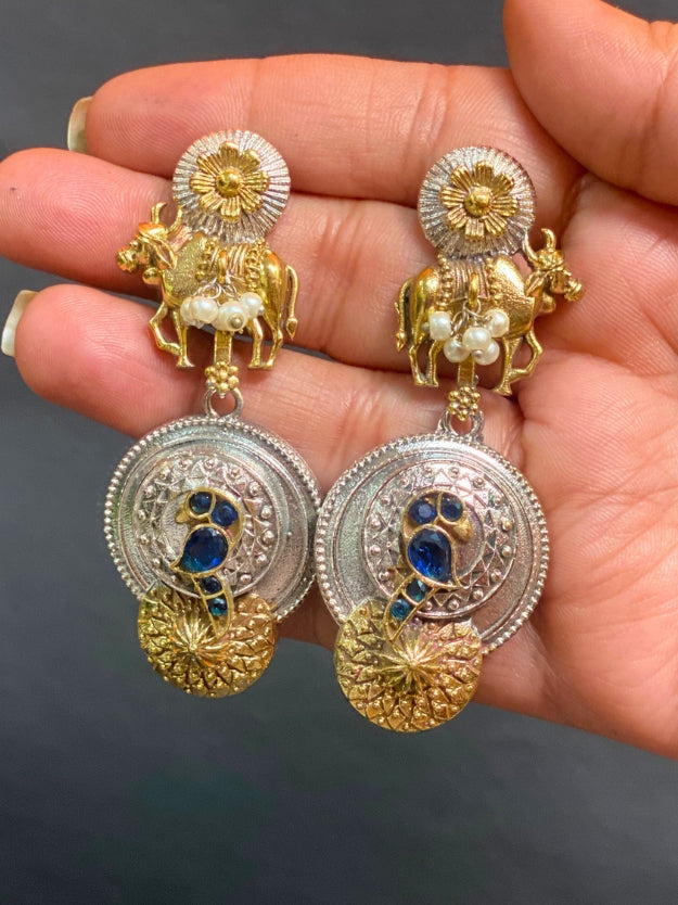 Traditional Oxidised Peacock & Cow Design Dangler Earrings with Pearl Detailing – Antique Gold & Silver Finish