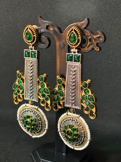 Oxidized Dual Tone Jhoomar Earrings with Green Kundan Stones