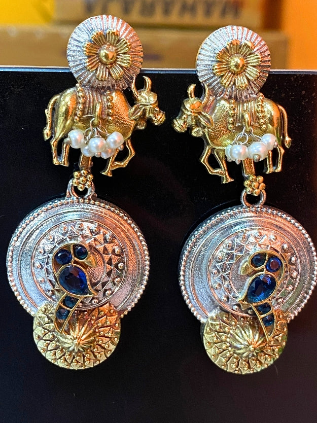 Traditional Oxidised Peacock & Cow Design Dangler Earrings with Pearl Detailing – Antique Gold & Silver Finish